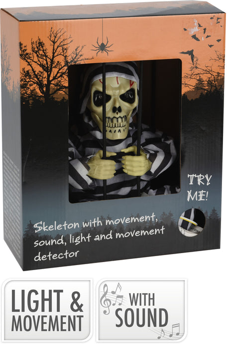 Halloweenkoriste luuranko häkissä